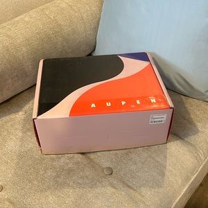 Brand new original packaging tag still on Aupen The Nirvana noir purse